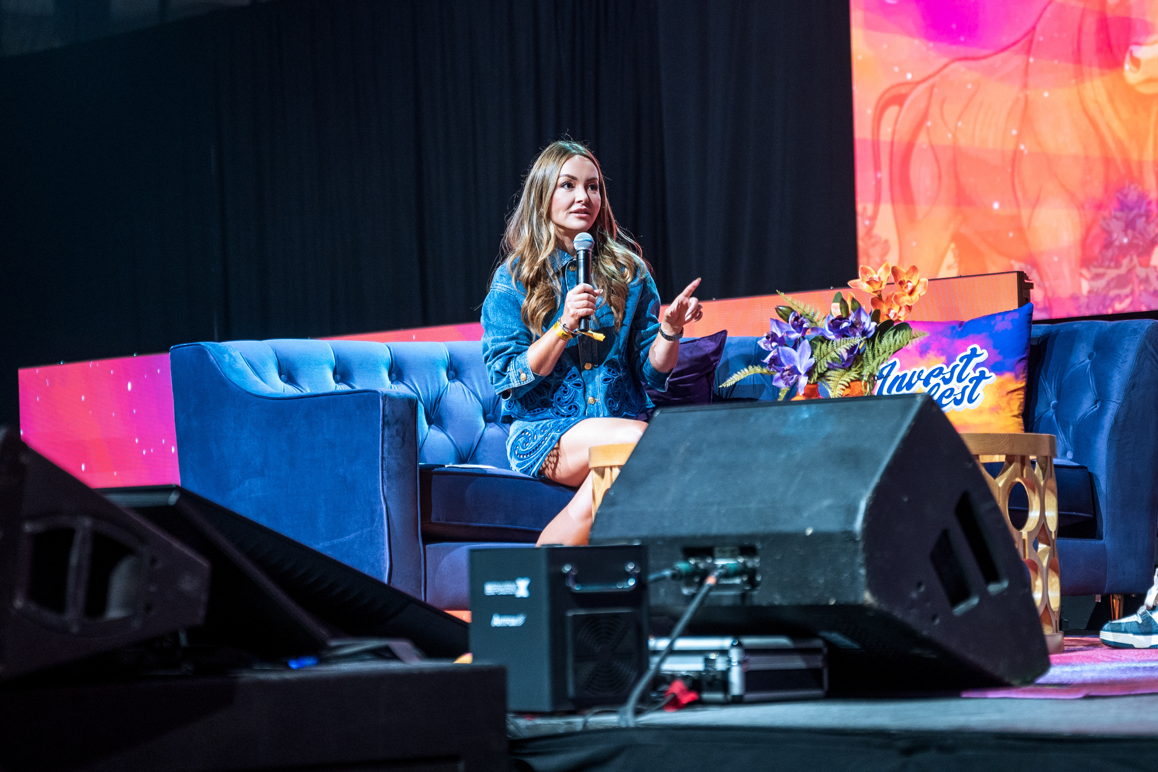 Nicole Lapin speaking on the InvestFest main stage in Atlanta in 2026