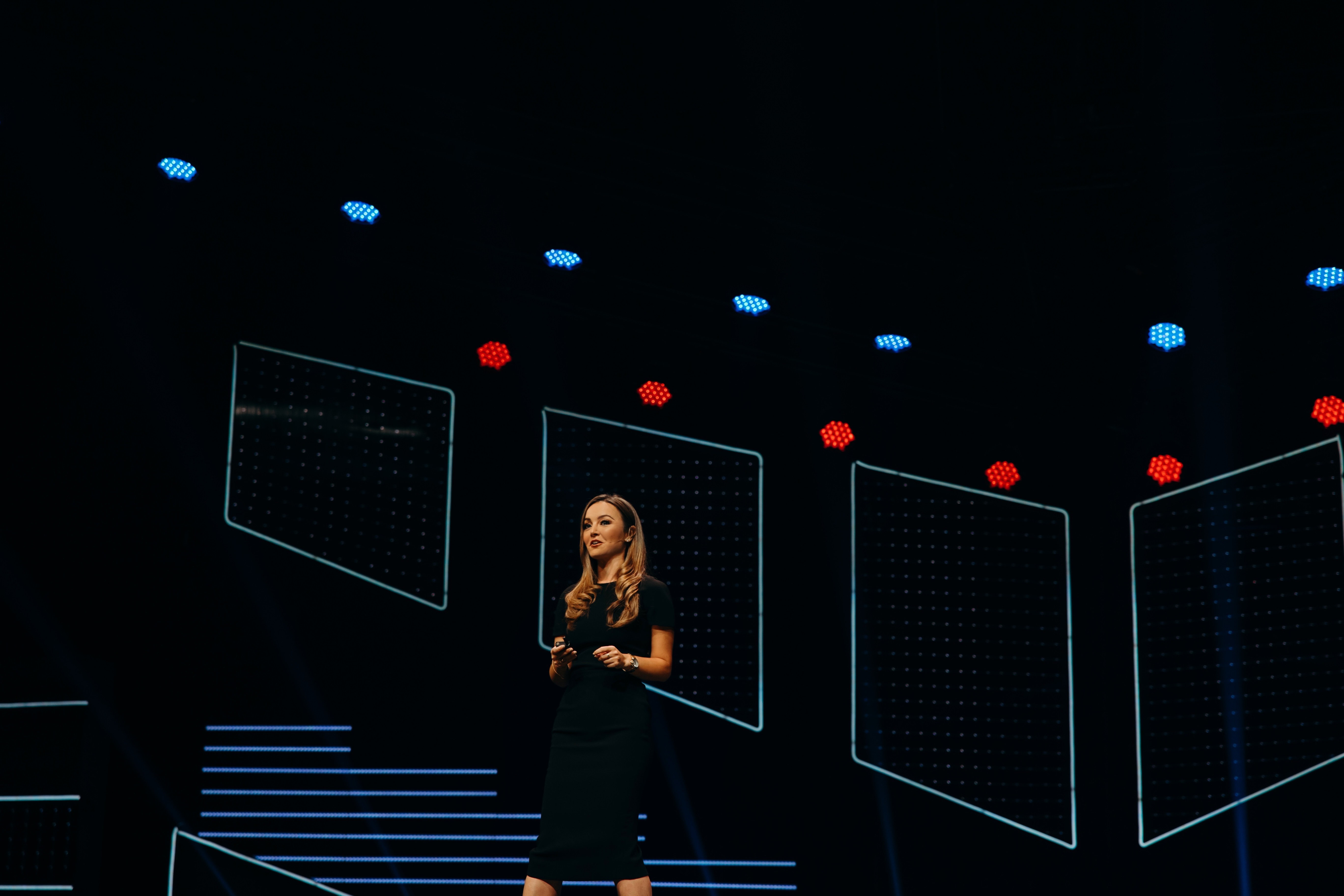 Nicole Lapin delivering a keynote on a large stage