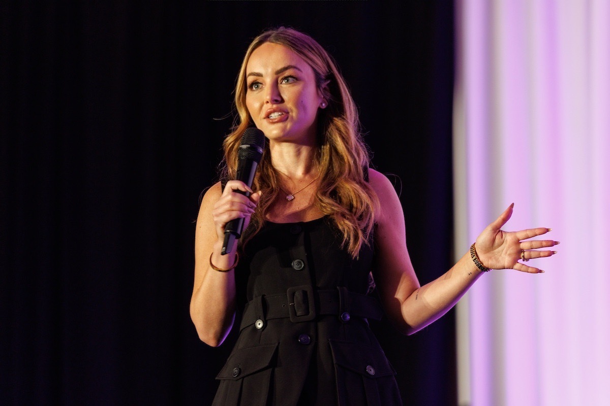 Nicole Lapin delivering a keynote on stage